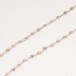 A diamond bead and fourteen karat gold necklace