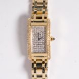 A fourteen karat gold and diamond dress wristwatch