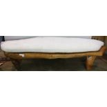 Natural free edge bench, having a shaped organic form with a custom cushion