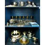 Three shelves of associated silverplate table articles
