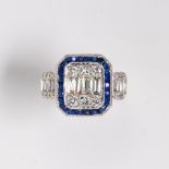 A sapphire, diamond and eighteen karat white gold ring