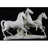 A Hutschenreuther porcelain figural scupture of galloping horses