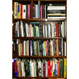 Four shelves of books on mostly art, music, theology and culture