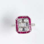 A ruby, diamond and eighteen karat white gold ring