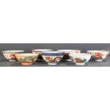 (Lot of 7) A Group of Famille Rose 'Dragon and Phoenix' and 'Lion' Bowls