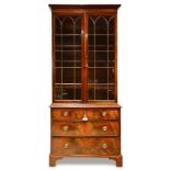 A George III mahogany breakfront bookcase