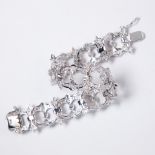 A diamond and eighteen karat white gold bracelet