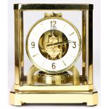 A Jaeger Le Coultre Atmos clock, executed in brass with a glass paneled case