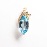 A blue topaz, diamond and fourteen karat gold pendant