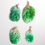 A group of four jade pendants