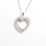 A diamond and fourteen karat white gold pendant necklace