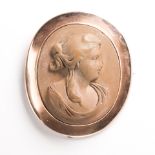 A lava cameo and nine karat gold brooch, Forster