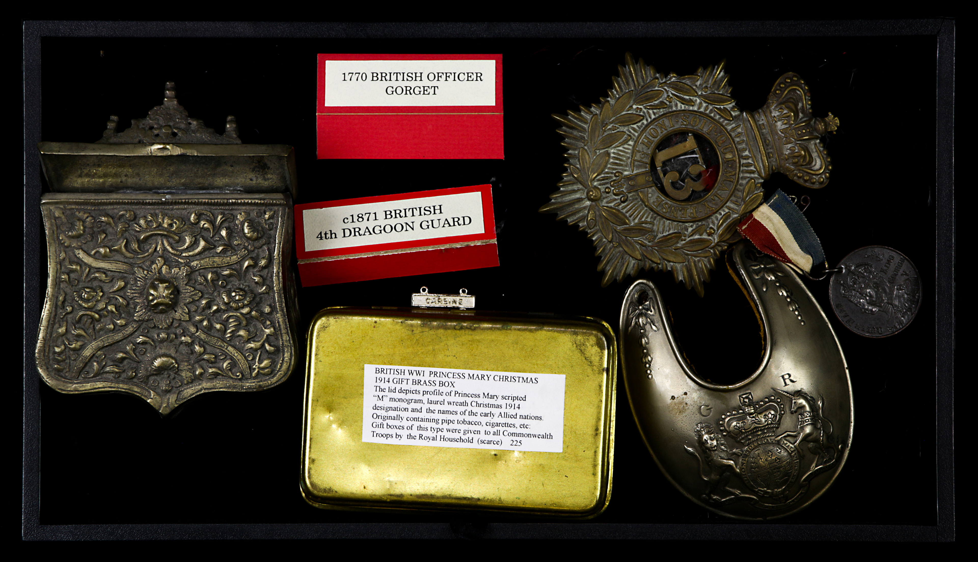 A collection of early British military metal items