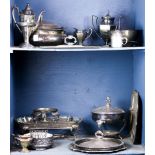 Two shelves of associated silver and pewter tablewares