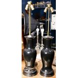 A pair of black ceramic lamps