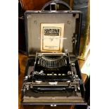 A cased Corona typewriter