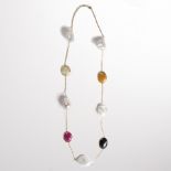 A multi-gemstone and eighteen karat gold necklace