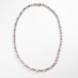 A diamond and eighteen karat white gold necklace