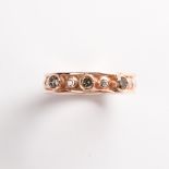 A cognac and champagne diamond fourteen karat rose gold ring