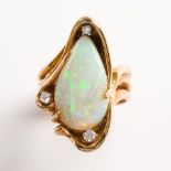 An opal, diamond and fourteen karat gold ring