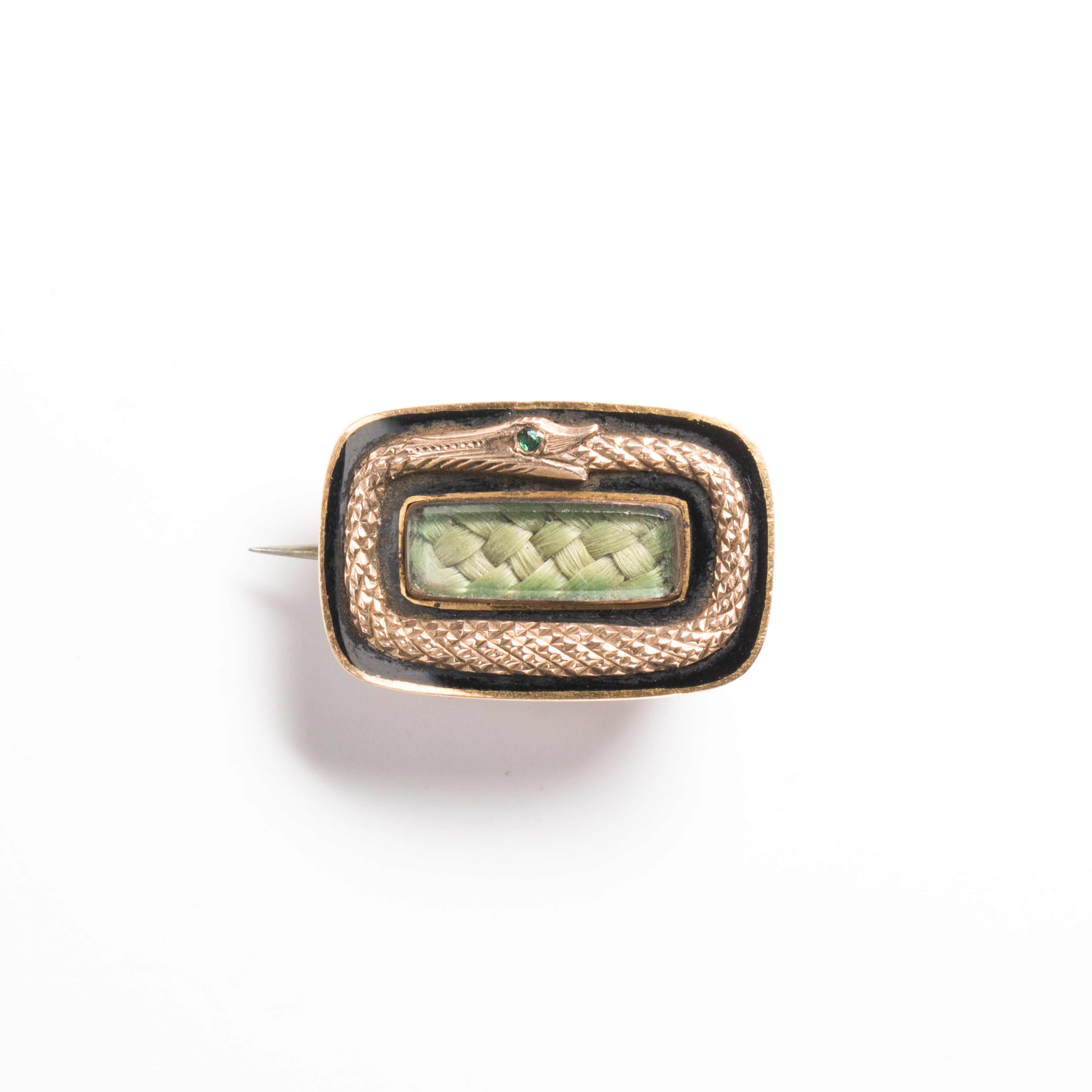 A Victorian enameled fourteen karat gold mourning brooch