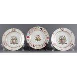 A (lot of 3) Chinese Export porcelain plates, including an armorial pair