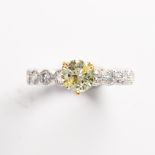 A yellow and colorless diamond fourteen karat white gold ring