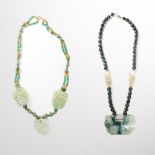 A group of jade bead necklaces