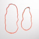 A group of coral bead necklaces