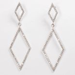 A pair of diamond and eighteen karat white gold earrings