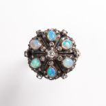 An opal, diamond and silver-topped eighteen karat gold ring