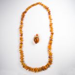 An amber necklace and brooch