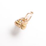 A gem-set fourteen karat gold charm