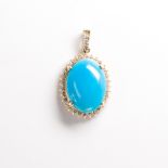 A turquoise, diamond and fourteen karat gold pendant