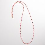 A ruby and eighteen karat gold necklace