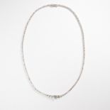 A diamond and fourteen karat white gold rivière necklace