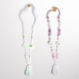 A group of lavender jade bead necklaces