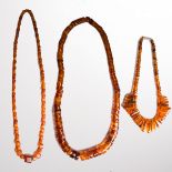 A group of amber bead necklaces