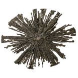 A contemporary Brutalist wall hanging starburst sculpture