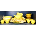 One shelf of Metlox "Lotus by Poppytrail" yellow china service