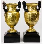 A pair of Neoclassical style gilt bronze urns