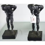 A pair of Classical style patinated bronze figural bookends