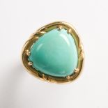 A turquoise and eighteen karat gold ring