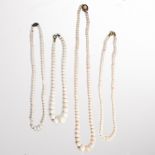 A group of white coral bead necklaces