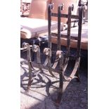 Spanish Revival style wrought iron firewood holder