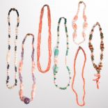 A group of coral bead necklaces