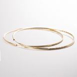 A pair of ten karat gold hoop earrings