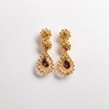 A pair of diamond and gemstone twenty-two karat gold earrings