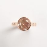 A diamond and eighteen karat rose gold ring