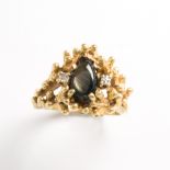 A synthetic black star sapphire, diamond and eighteen karat gold ring
